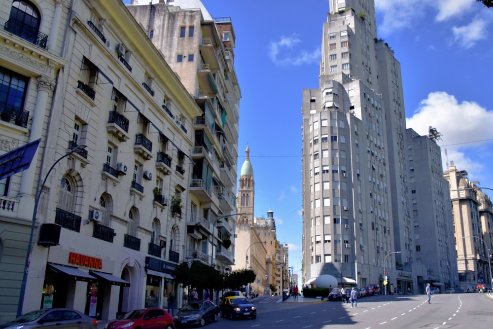 a city street with tall buildings on both sides