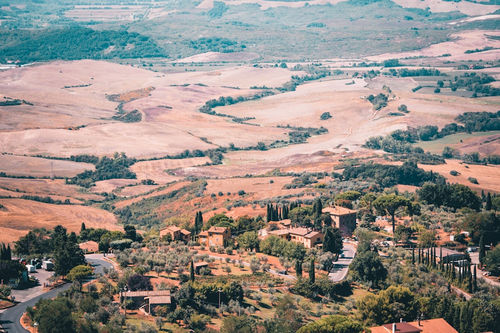 an aerial view of a village in a valley