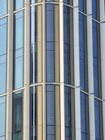 Completed facade with clean lines and modern finish, viewed from street level.