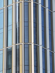Detailed view of steel and glass facade highlighting industrial luxury design elements.