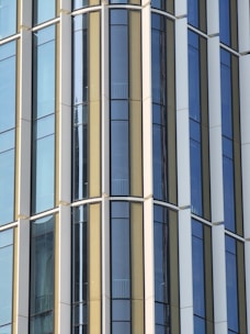 Detailed view of steel and glass facade highlighting industrial luxury design elements.