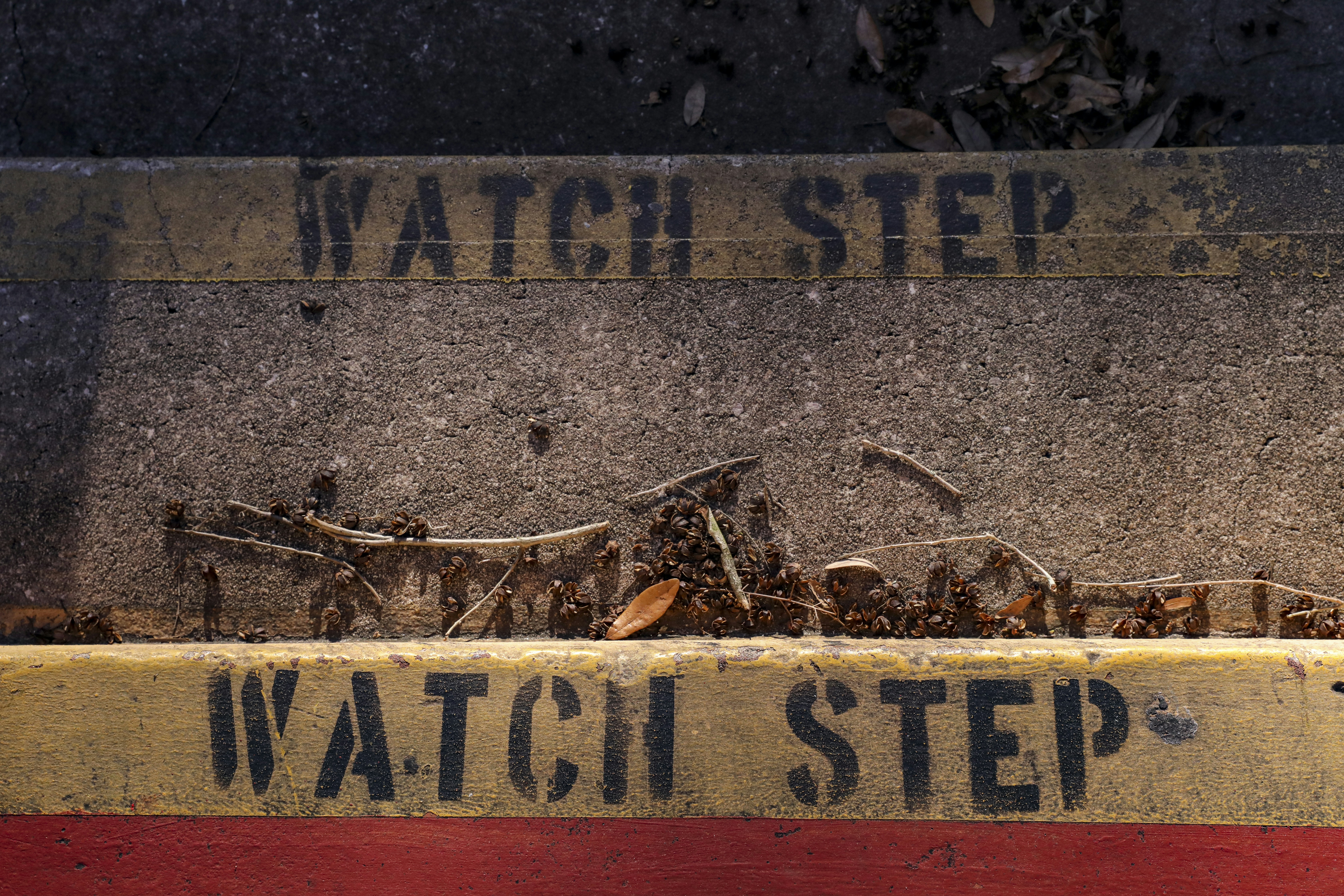 a watch step sign on the side of a building
