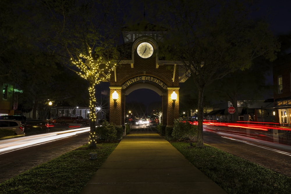 a clock tower is lit up at night