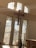Sunlight streaming through stained glass windows onto a small, cozy church interior filled with smiling members.