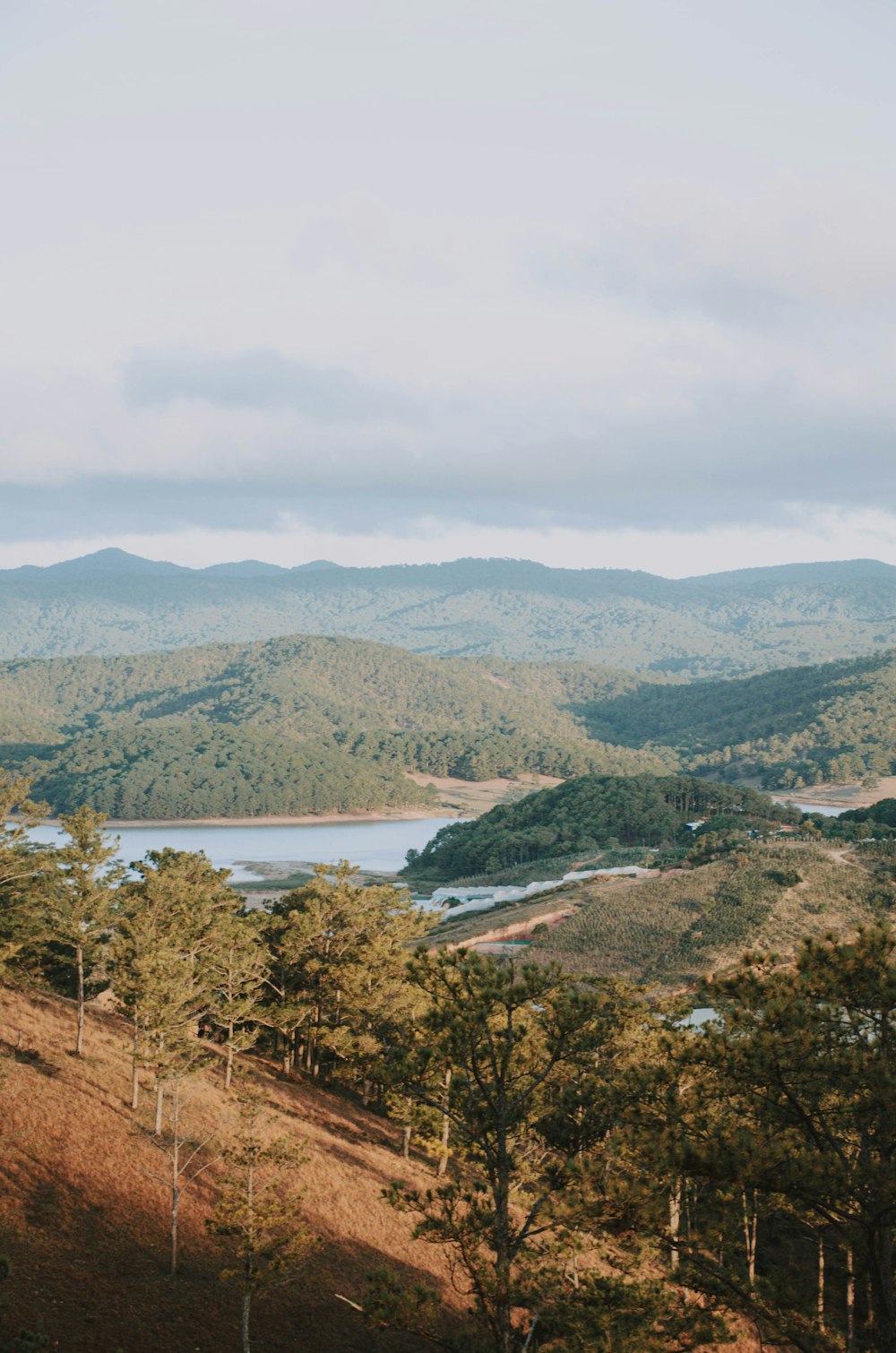 a scenic view of a lake surrounded by mountains