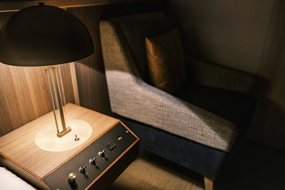 a lamp sitting on top of a wooden table