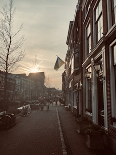 Photo showing a peaceful street scene in a Nigerian city at sunset, highlighting everyday life.