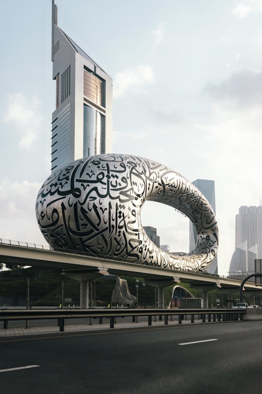 a large building with a giant snake on it's side