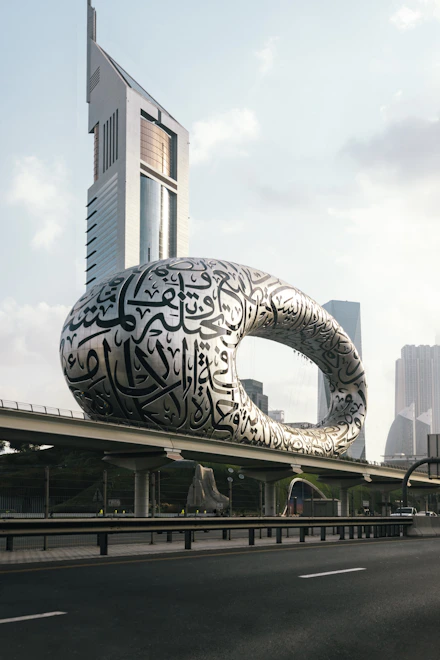 a large building with a giant snake on it's side