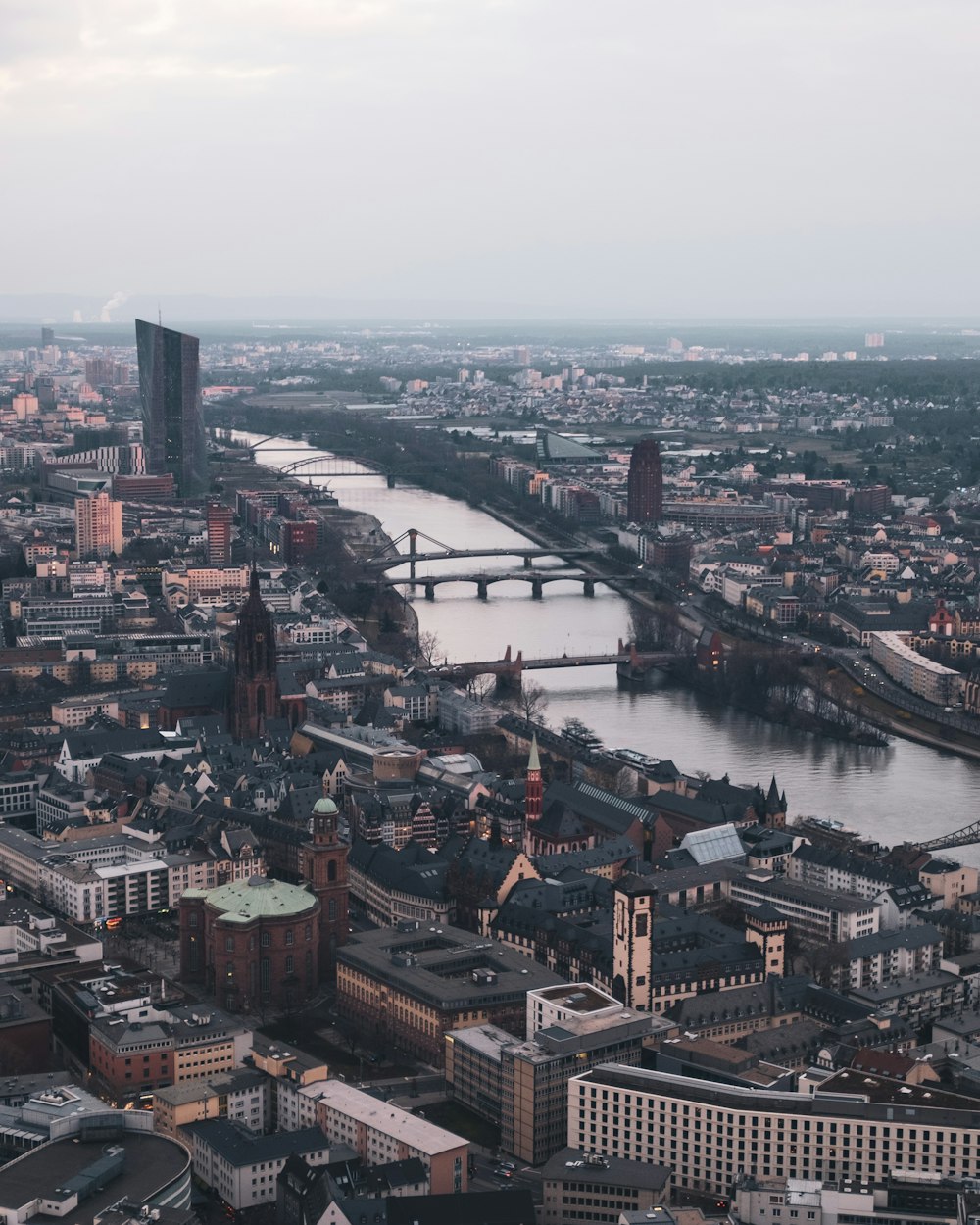 an aerial view of a city with a river running through it