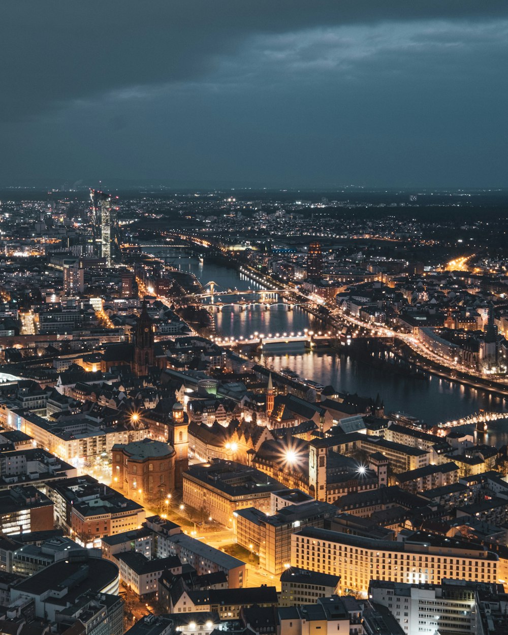 a view of a city at night from the top of a building