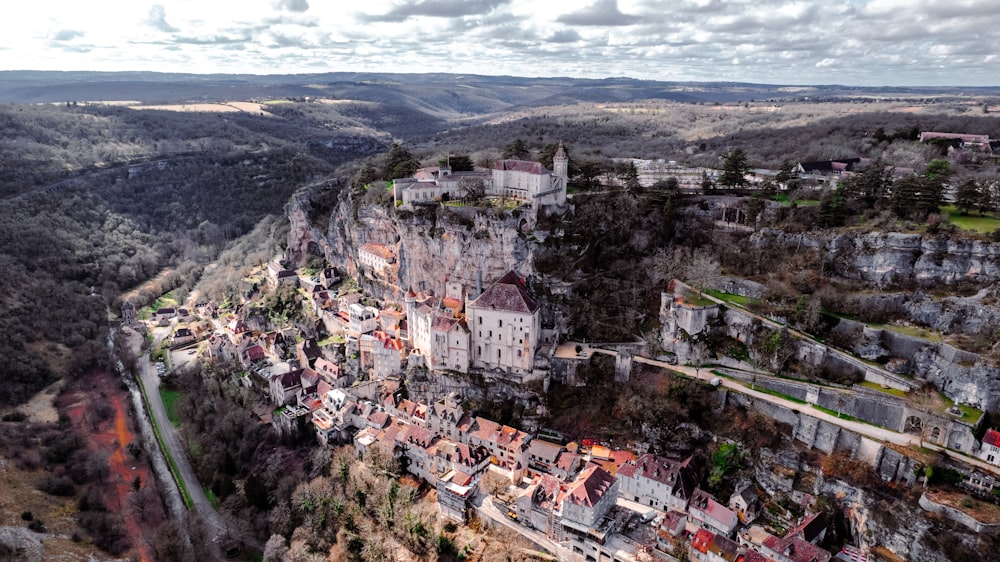 an aerial view of a village in the mountains