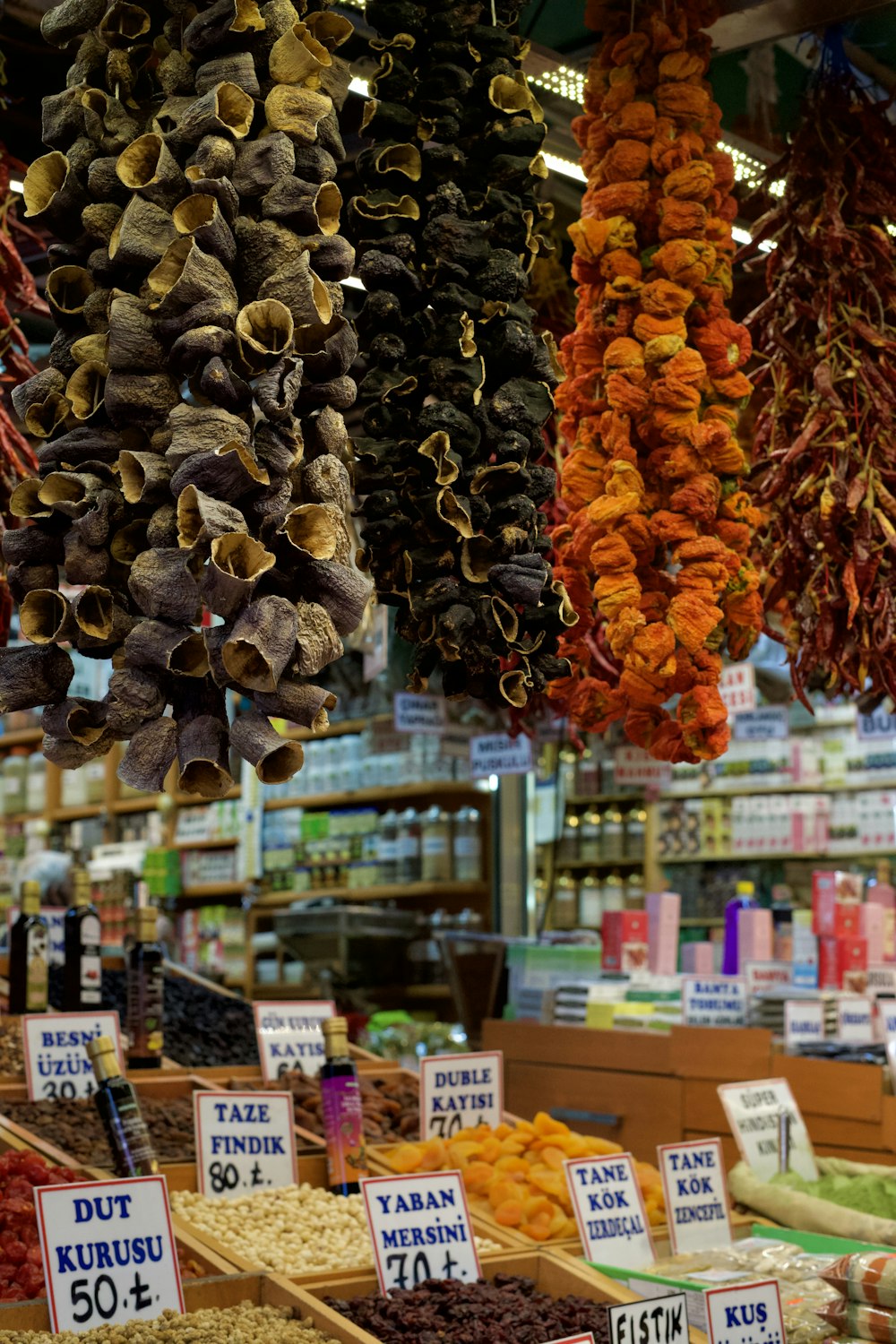 a store filled with lots of dried fruits and vegetables