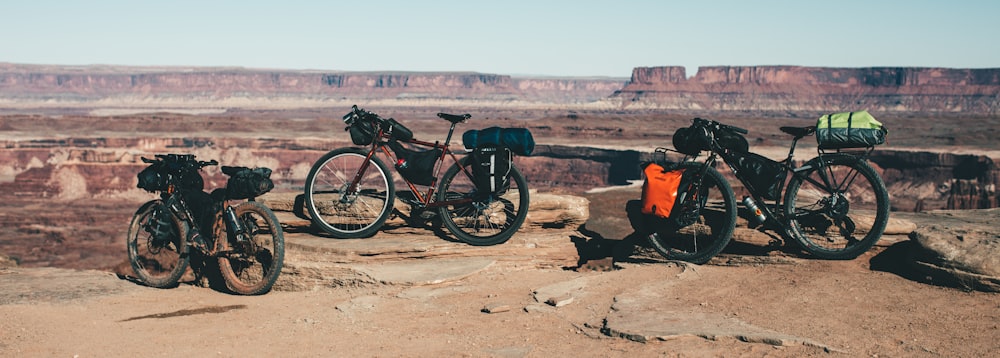 a couple of bikes that are sitting on a rock