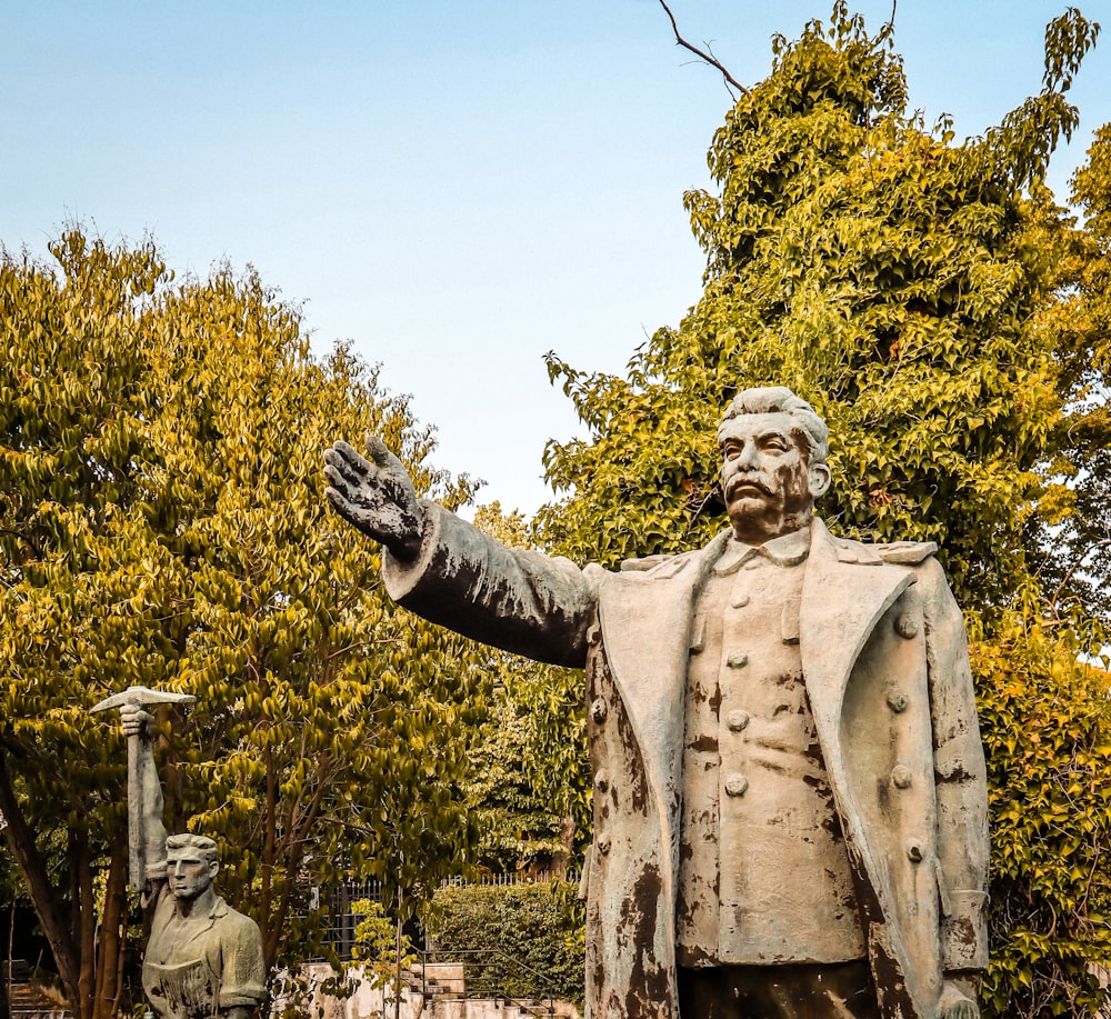 a statue of a man in a suit and tie