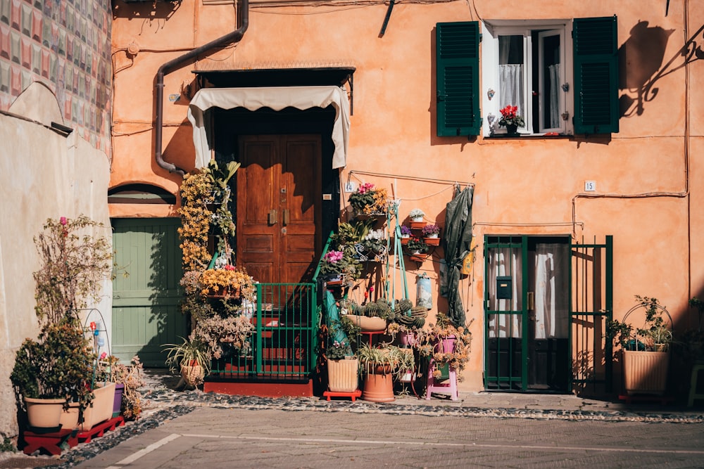 a building with potted plants in front of it