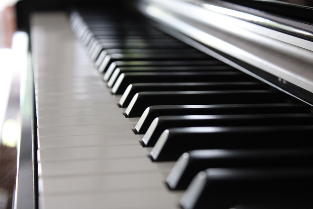 a close up of a black and white piano