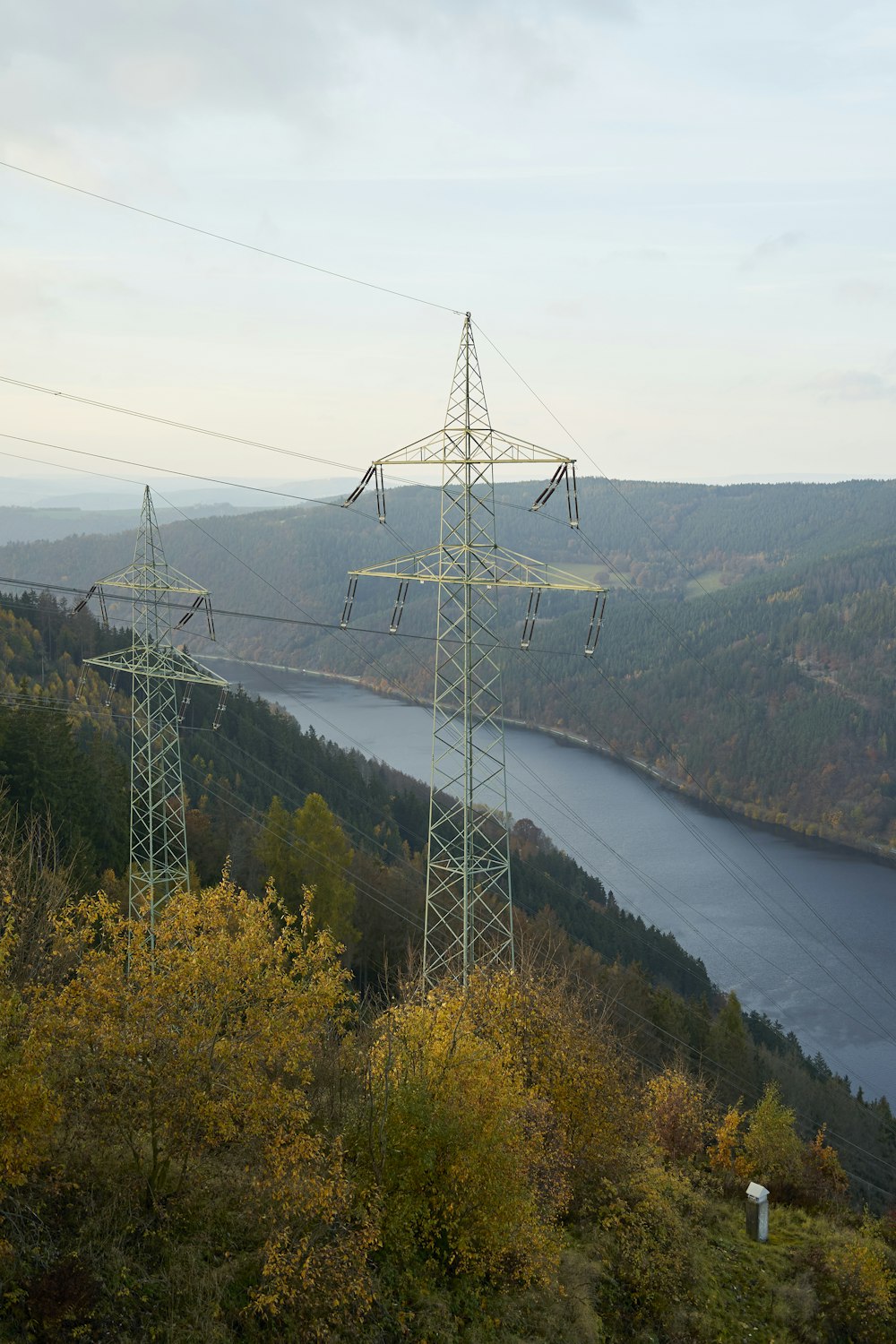 a view of a body of water and power lines