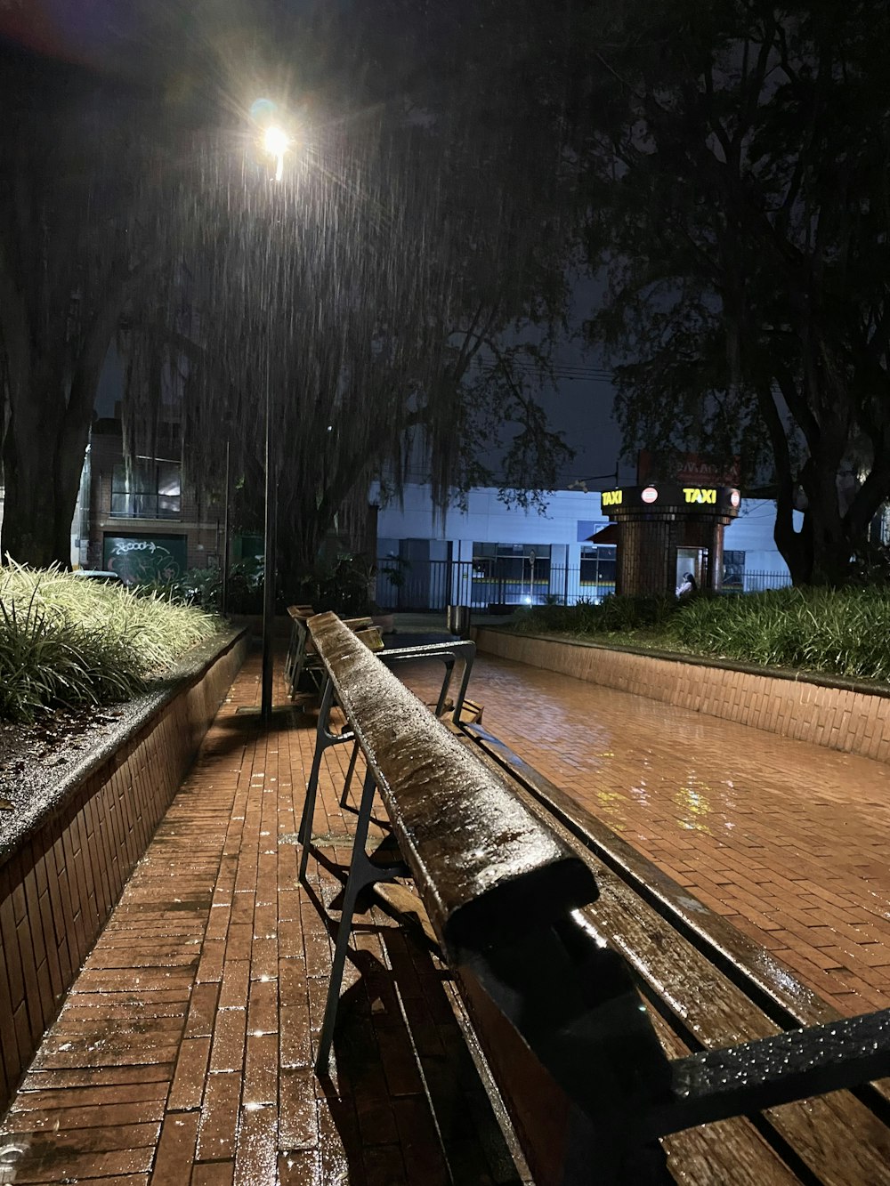 a wooden bench sitting on top of a wooden walkway