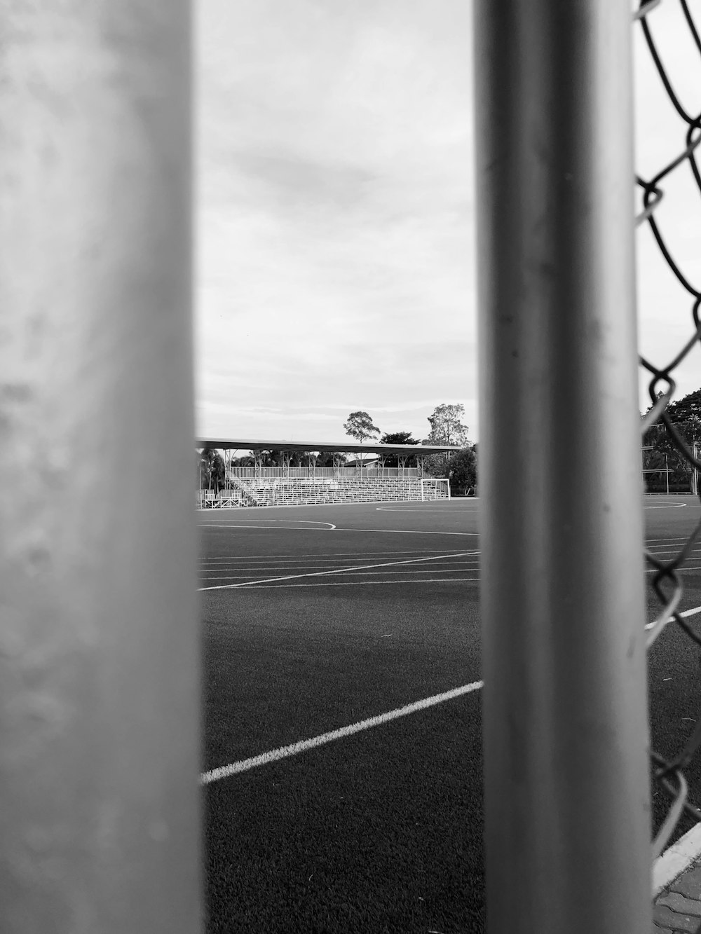 a black and white photo of a soccer field