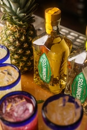 a table topped with glasses filled with drinks