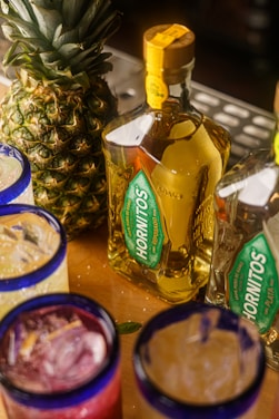 a table topped with glasses filled with drinks