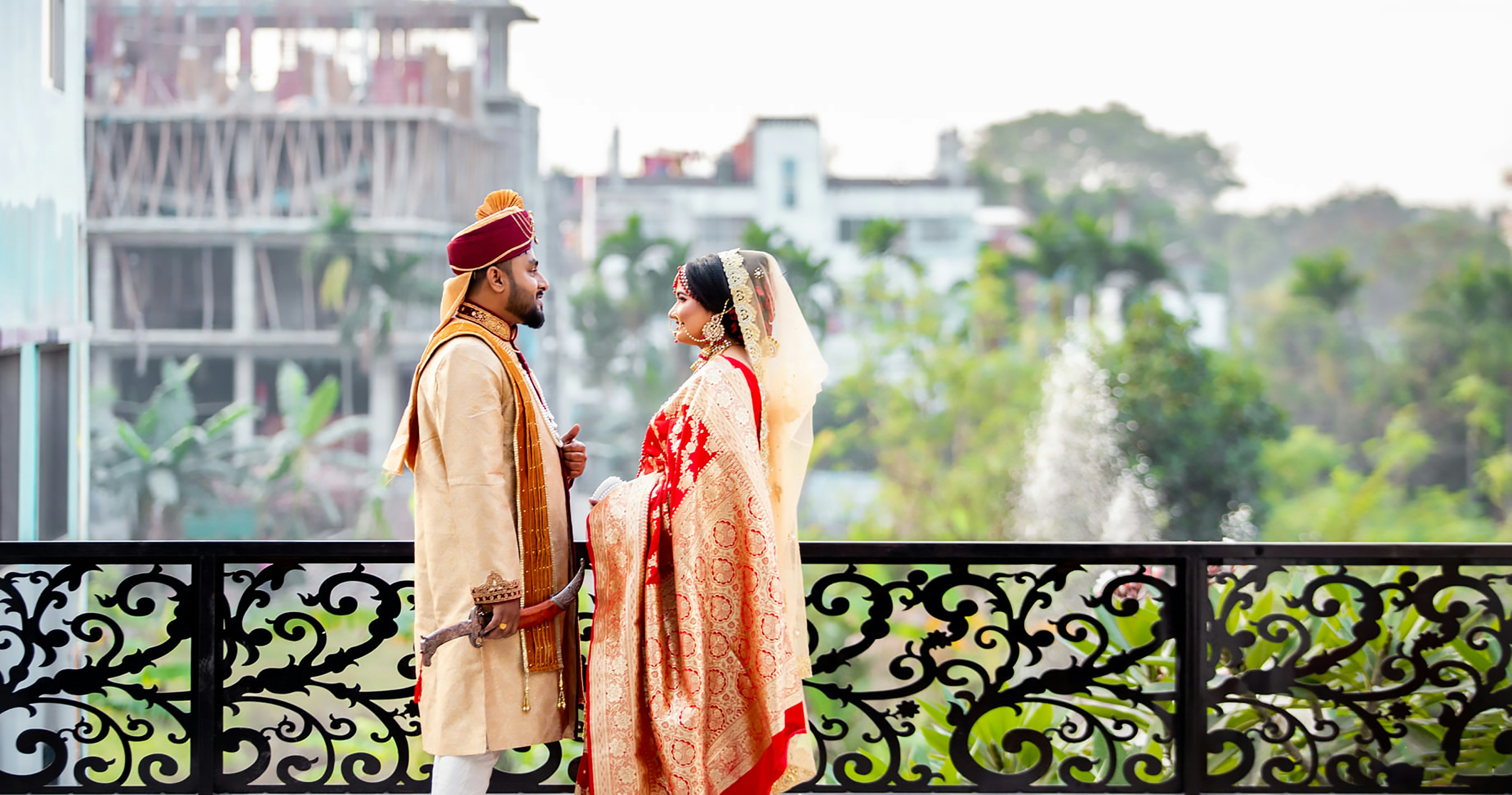 Couple standing next to each other in royal setting