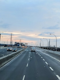 Wide highway with trucks transporting goods across regions.