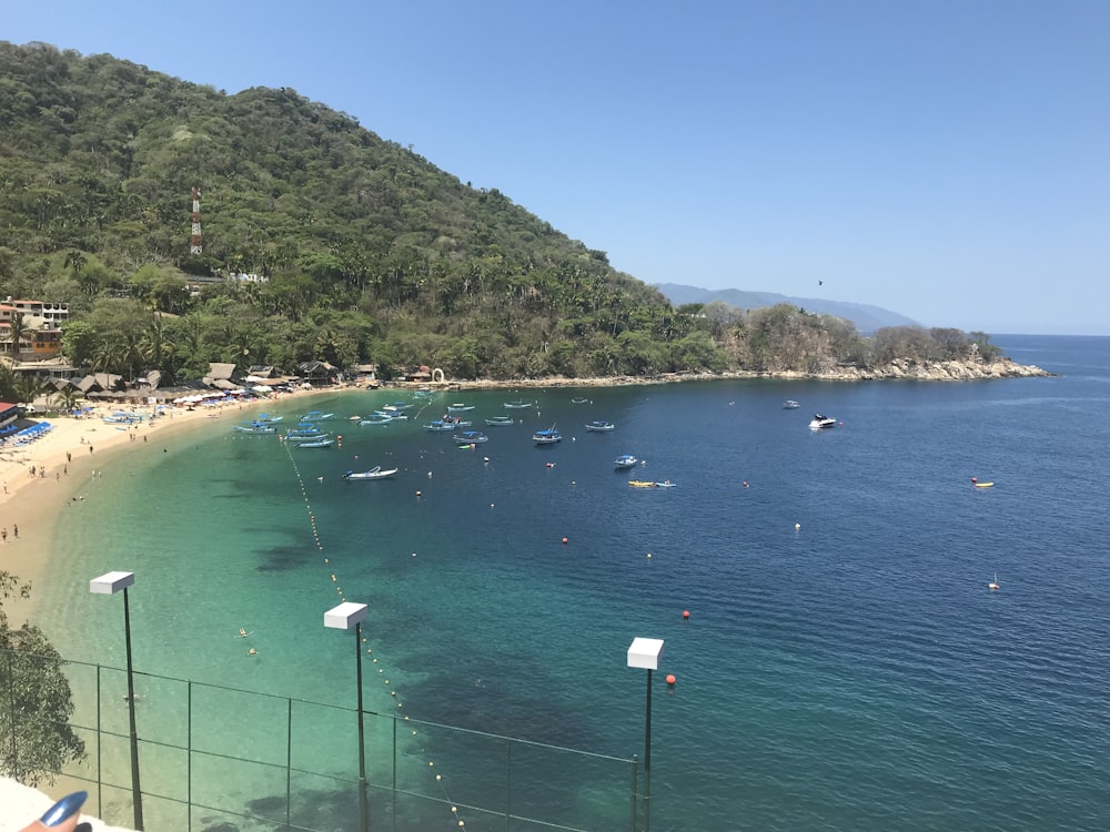 a view of a beach with boats in the water