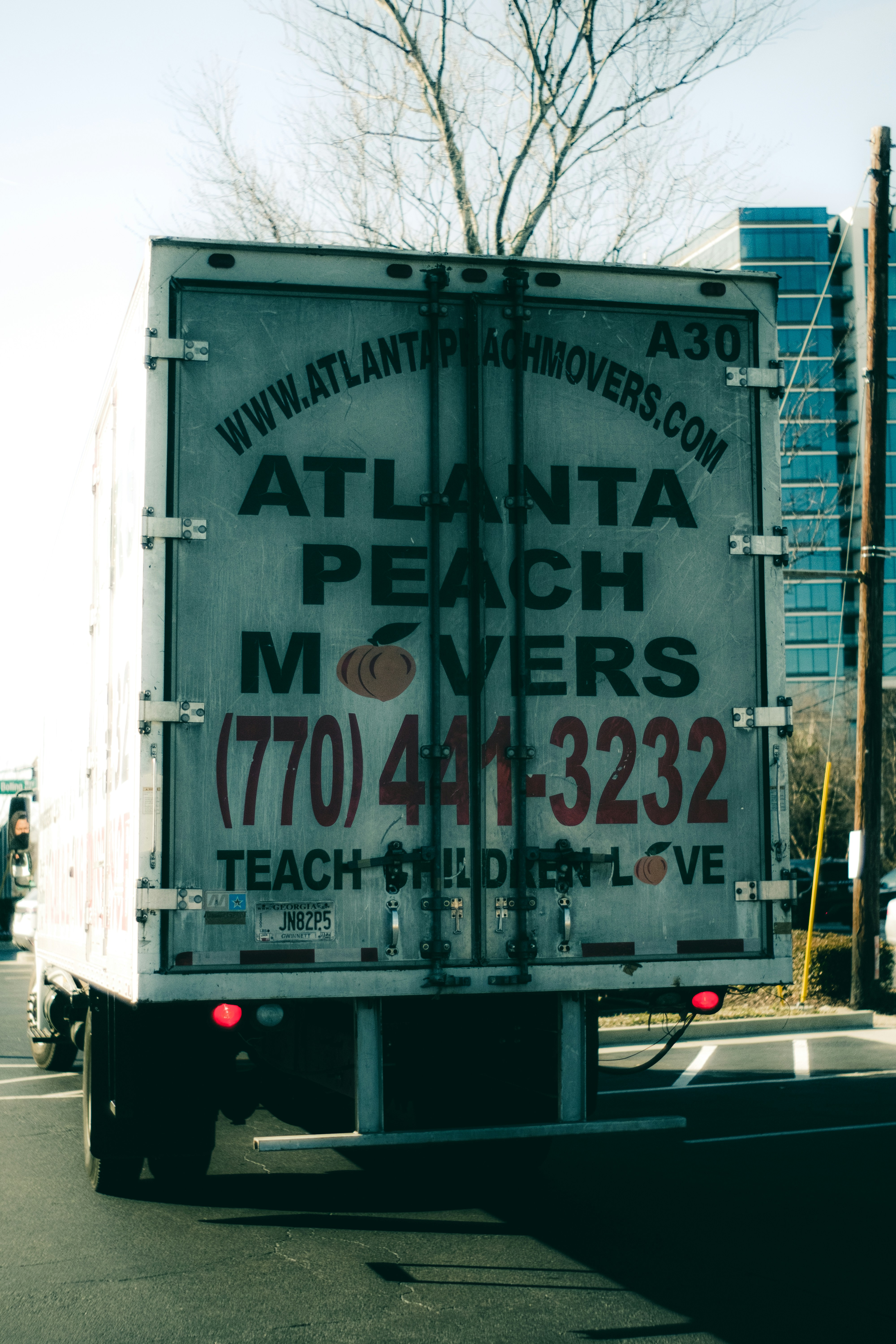 the back of a truck driving down a street
