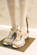 High-quality image of branded sneakers with gold accents.