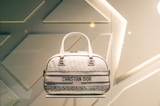 A stylish handbag displayed on a vibrant background.