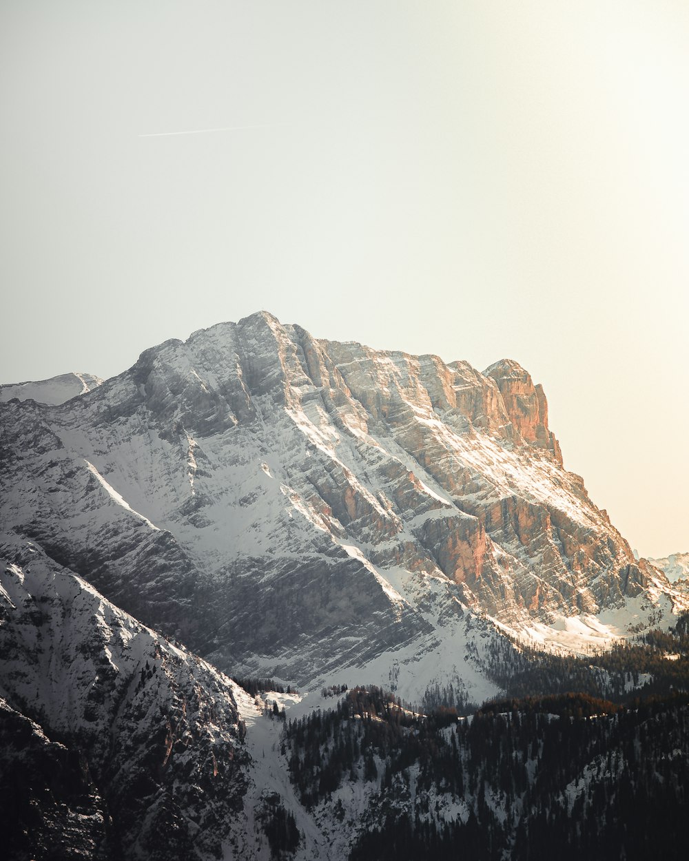 a snow covered mountain with a sky background