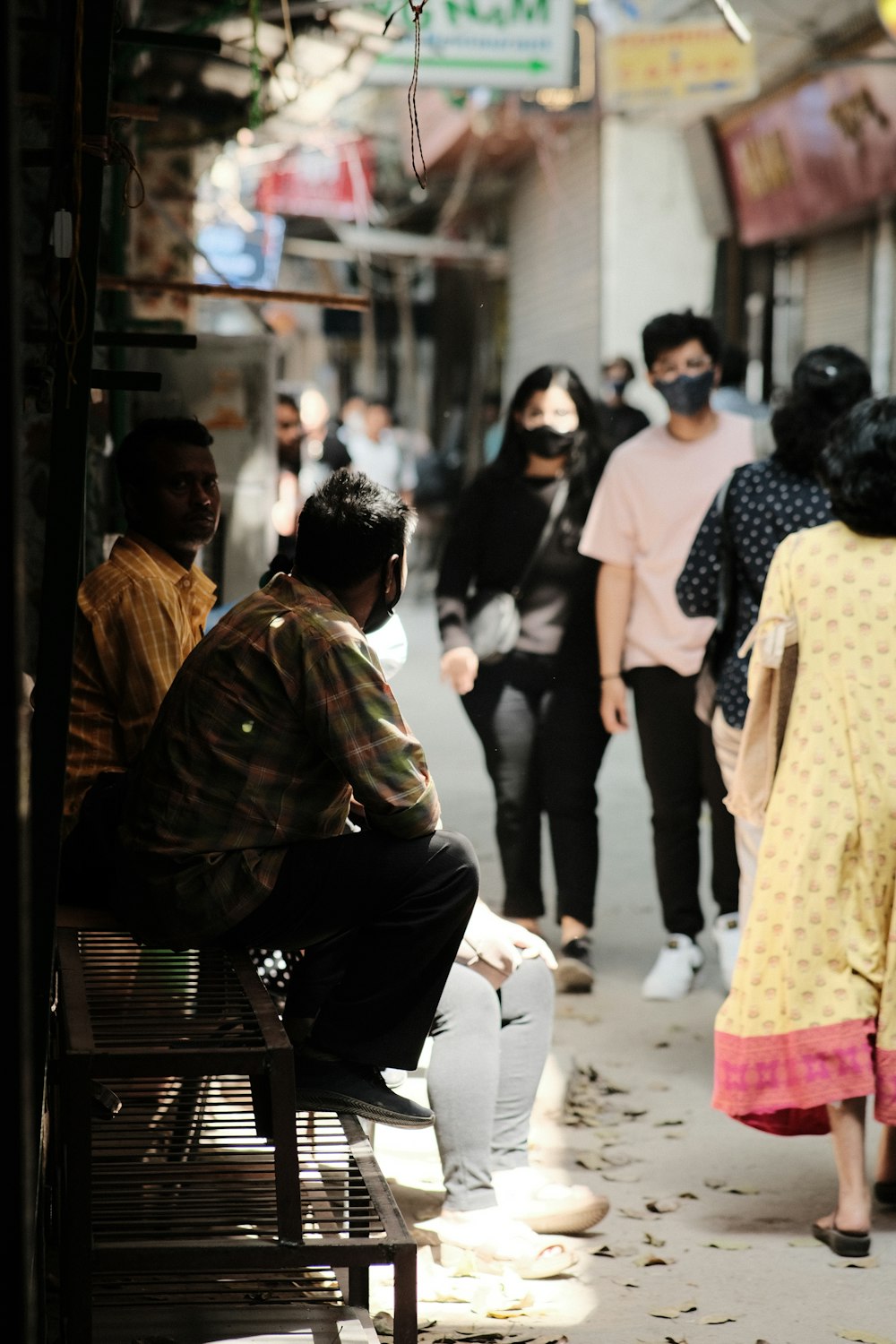 a group of people walking down a street