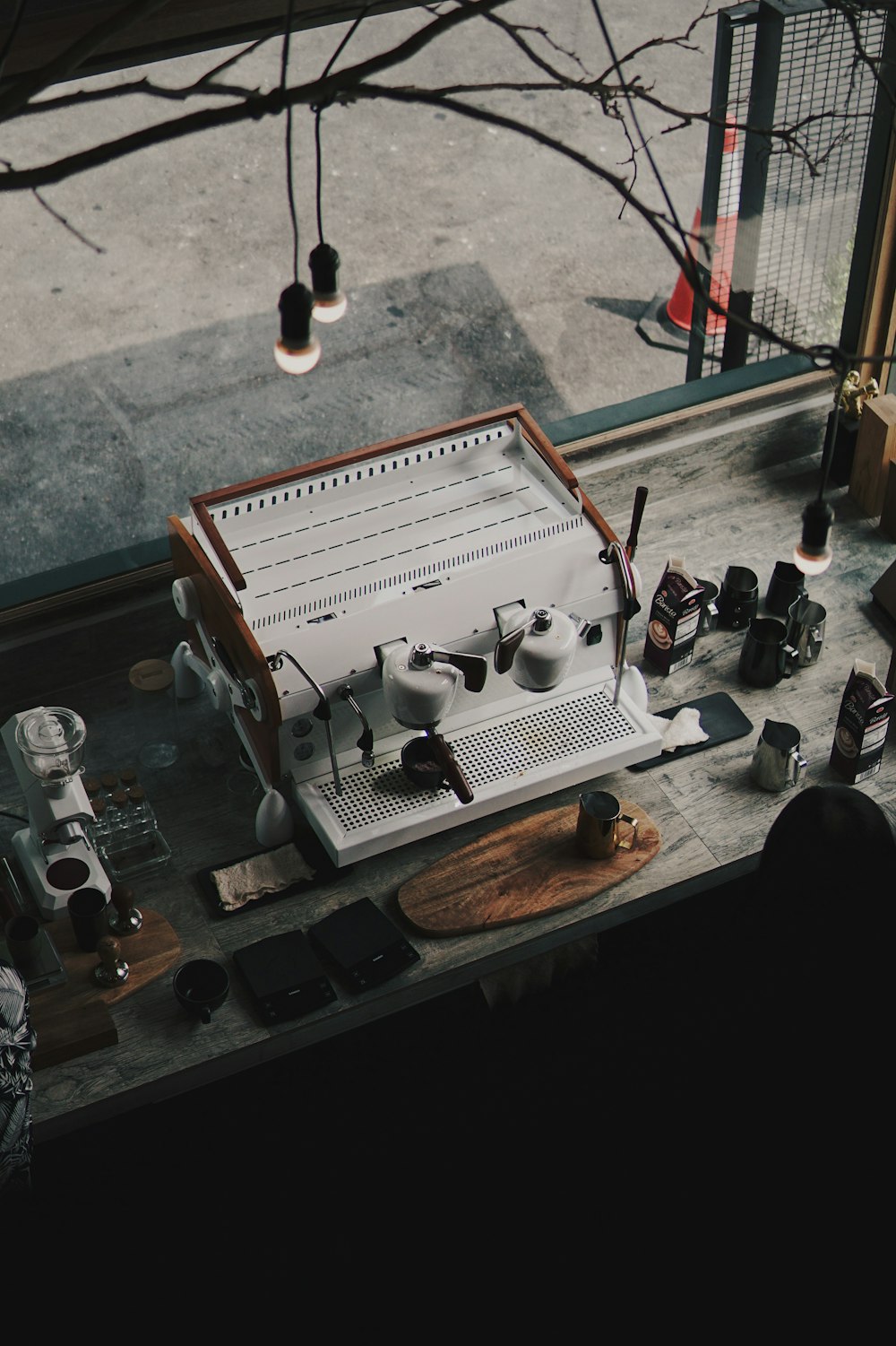 a coffee machine sitting on top of a counter next to a window