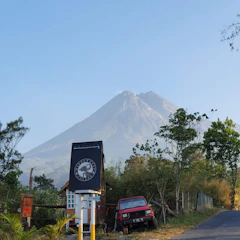A serene blue mountain logo with subtle environmental icons around it, reflecting sustainability and expertise.