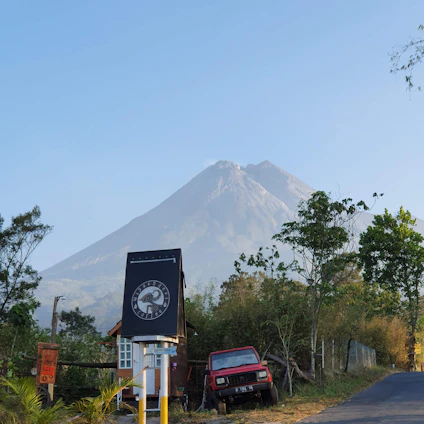 A serene blue mountain logo with subtle environmental icons around it, reflecting sustainability and expertise.