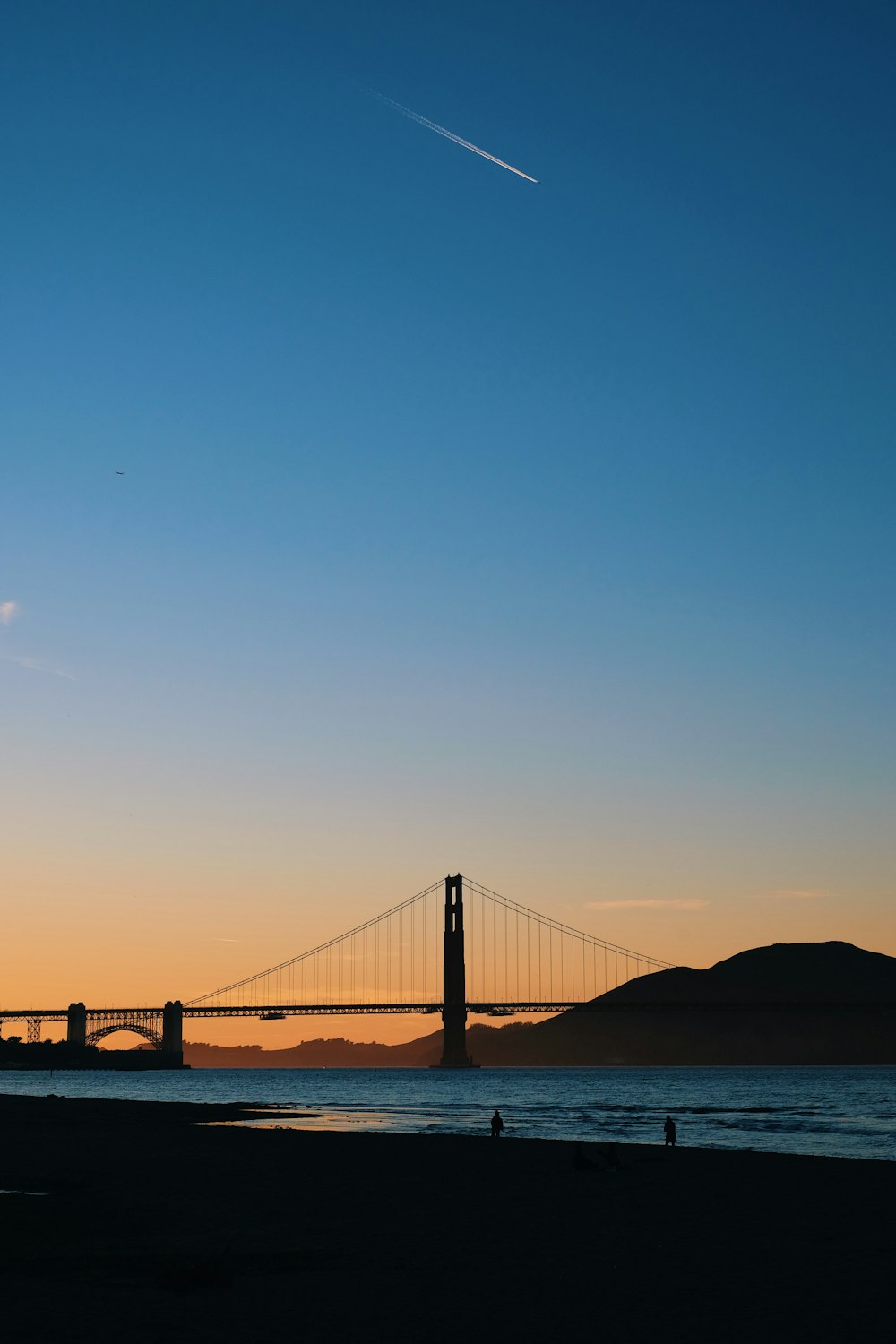 a view of the golden gate bridge at sunset