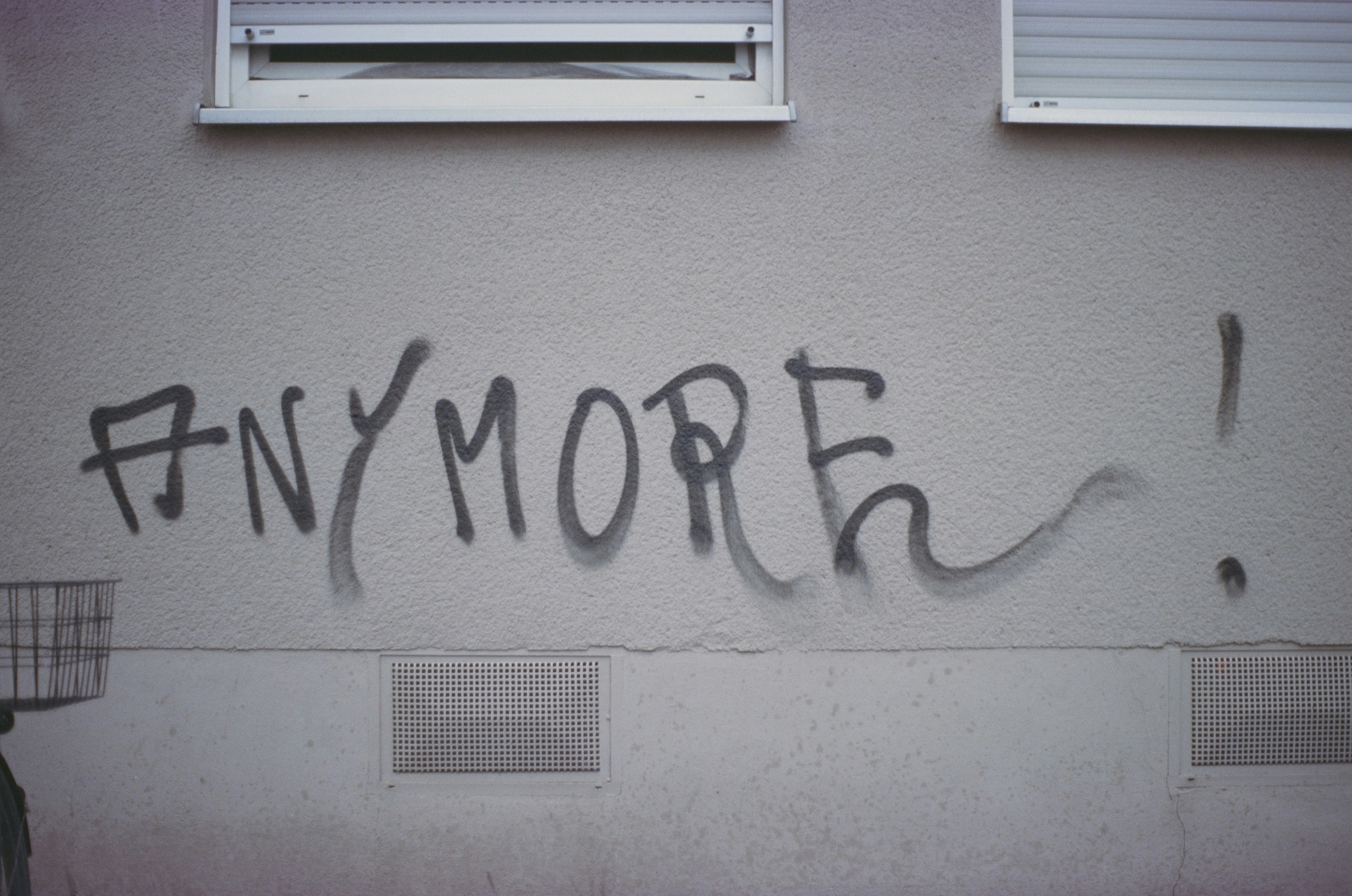 ANYMORE! Urban street art graffiti. Leica R7 (1994), Summilux-R 1.4 50mm (1983). Hi-Res analog scan by www.totallyinfocus.com – Kodak Elite Chrome 100 (expired 2004)