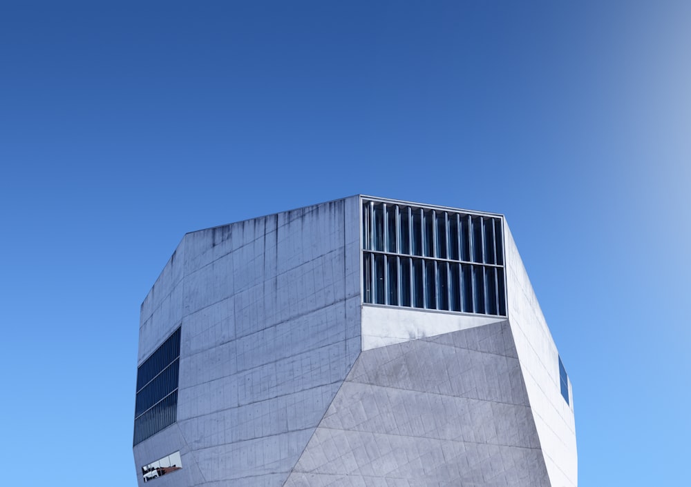 a tall building with a sky in the background