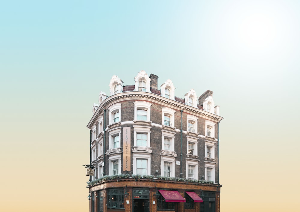 a tall building with a red awning on top of it