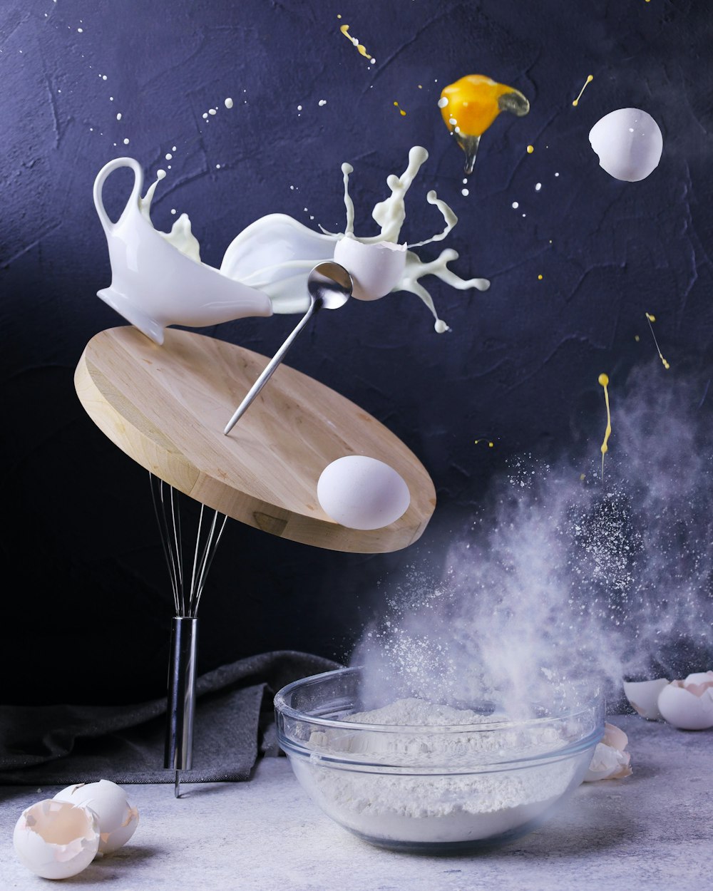 a wooden table topped with a bowl filled with white liquid