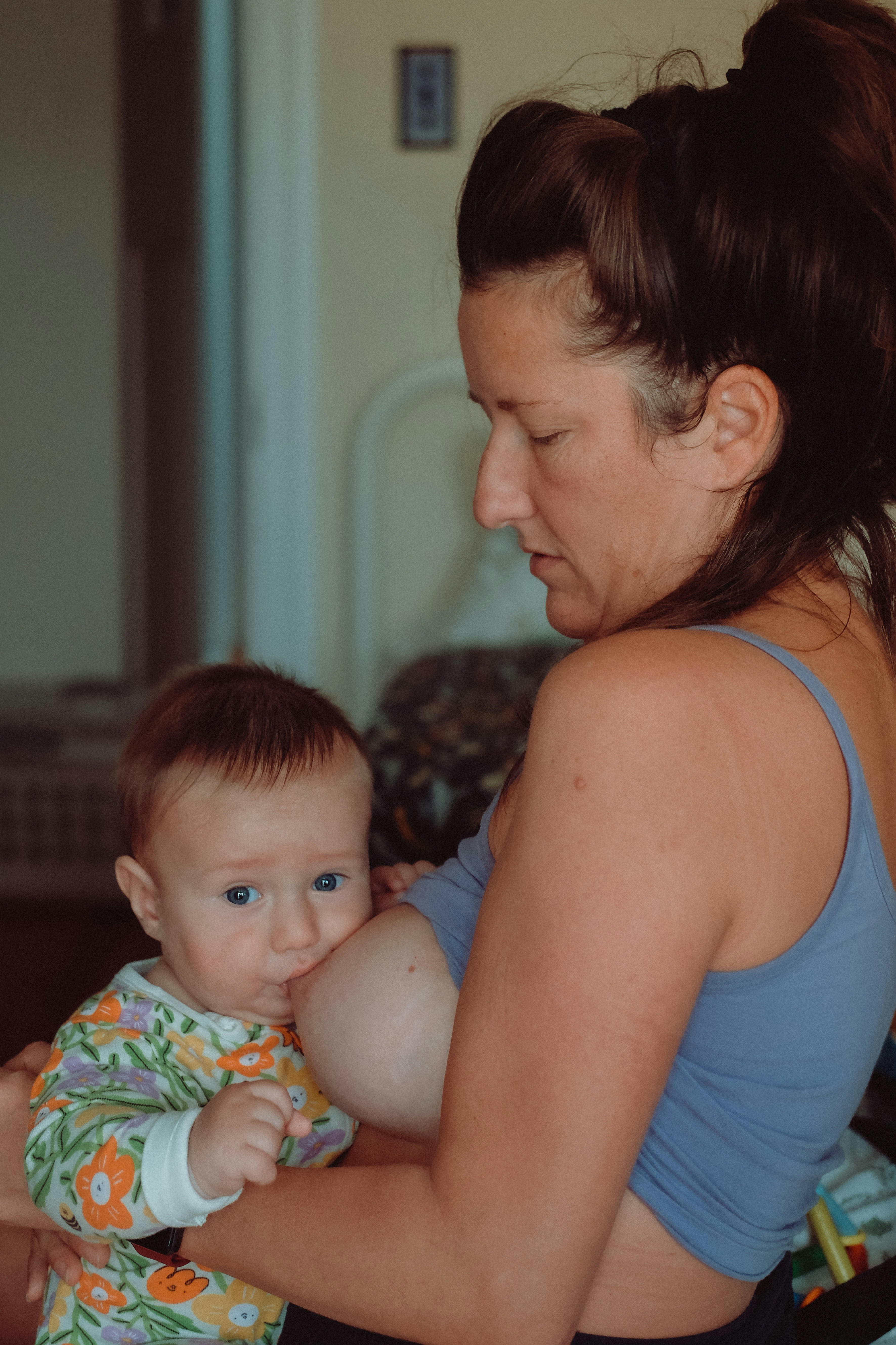a woman holding a baby in her arms