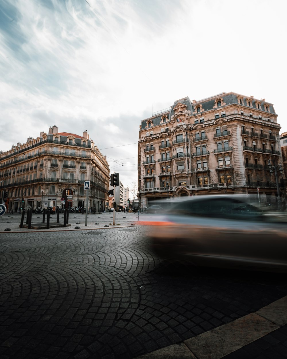 a blurry photo of a car driving down a street