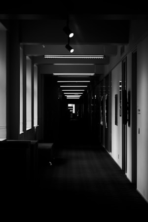A quiet school corridor with overhead lighting, representing school safety oversight in Clark County