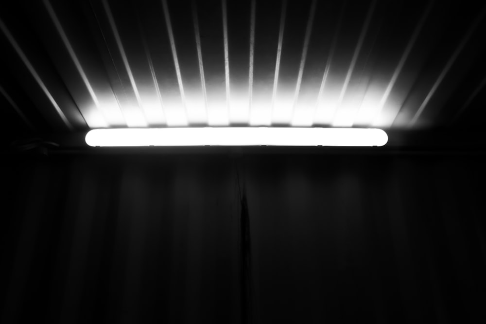a black and white photo of a light in a room