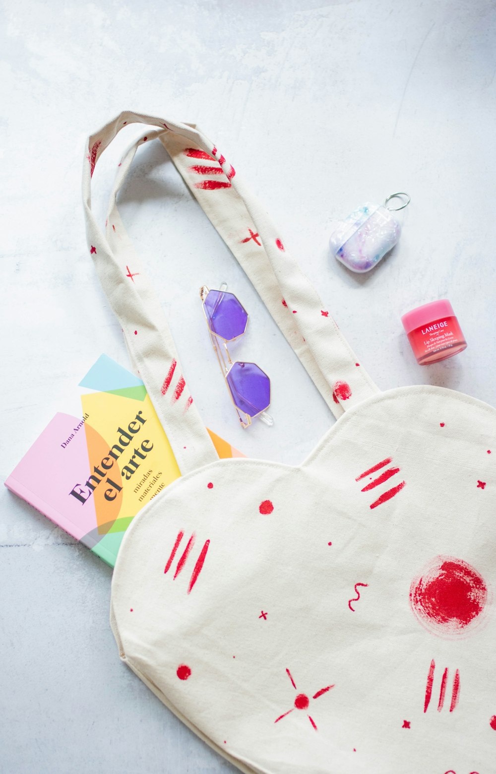 a heart shaped bag sitting on top of a table