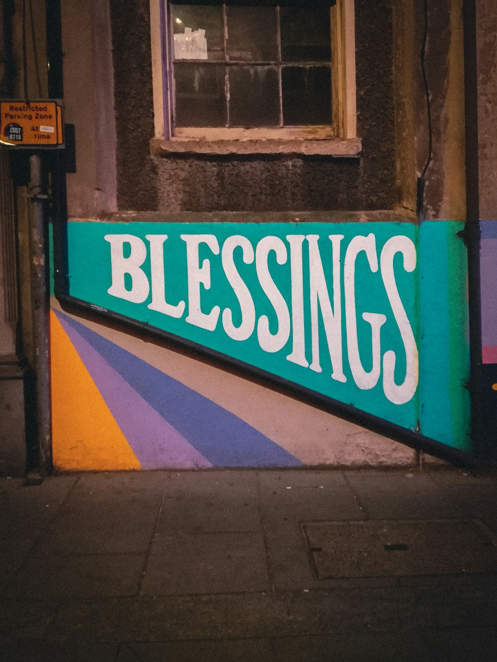 a sign on a building that says blessing