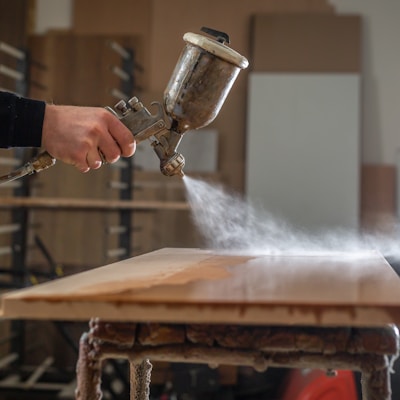 a person using a grinder on a wooden table