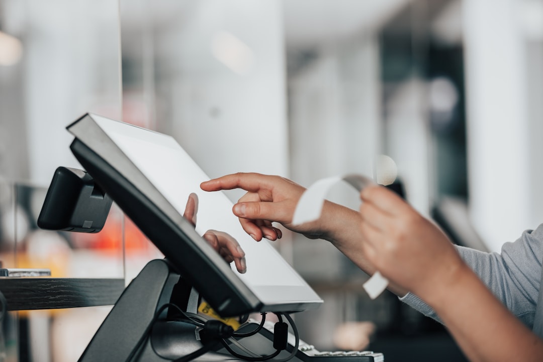 a person is using a pos machine in a store, Close up of saleswoman hands accounting, billing some goods for sale, finance concept